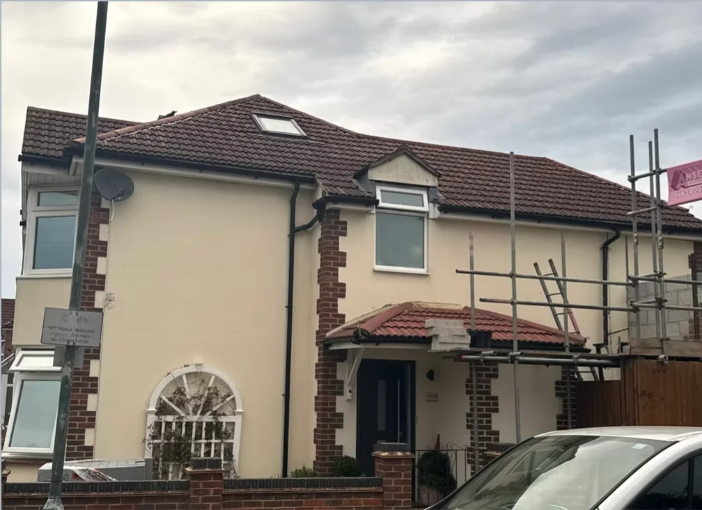 Exterior house painting with cream render in a Bromley residential street